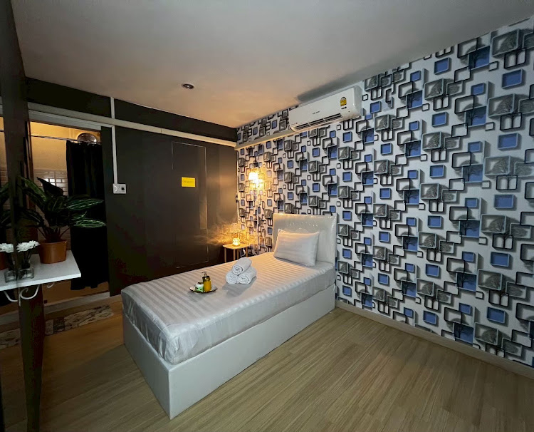 Single massage bed in a Kinnaree Spa treatment room