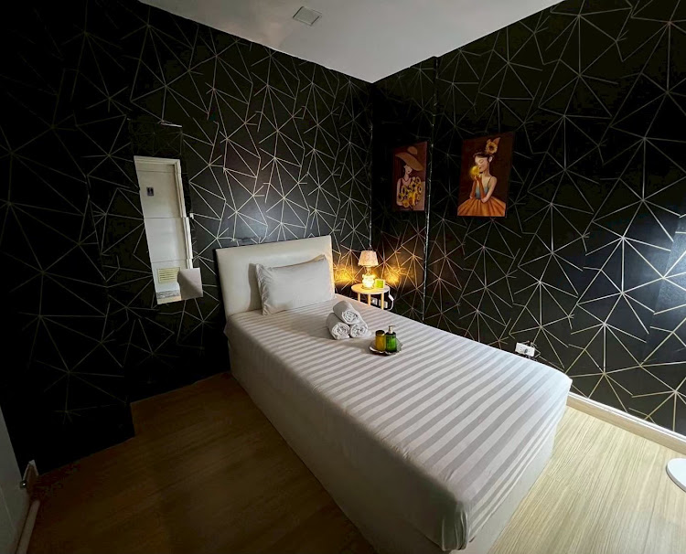 Massage bed and softly lit spa room